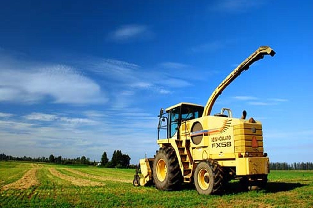 farm equipment on fieldyellow tractor on a field